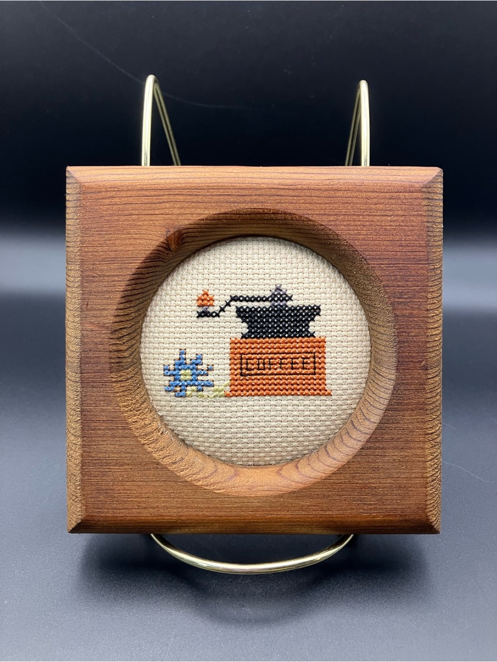 Handcrafted Orange Coffee Grinder Cross-Stitch in Wooden Frame